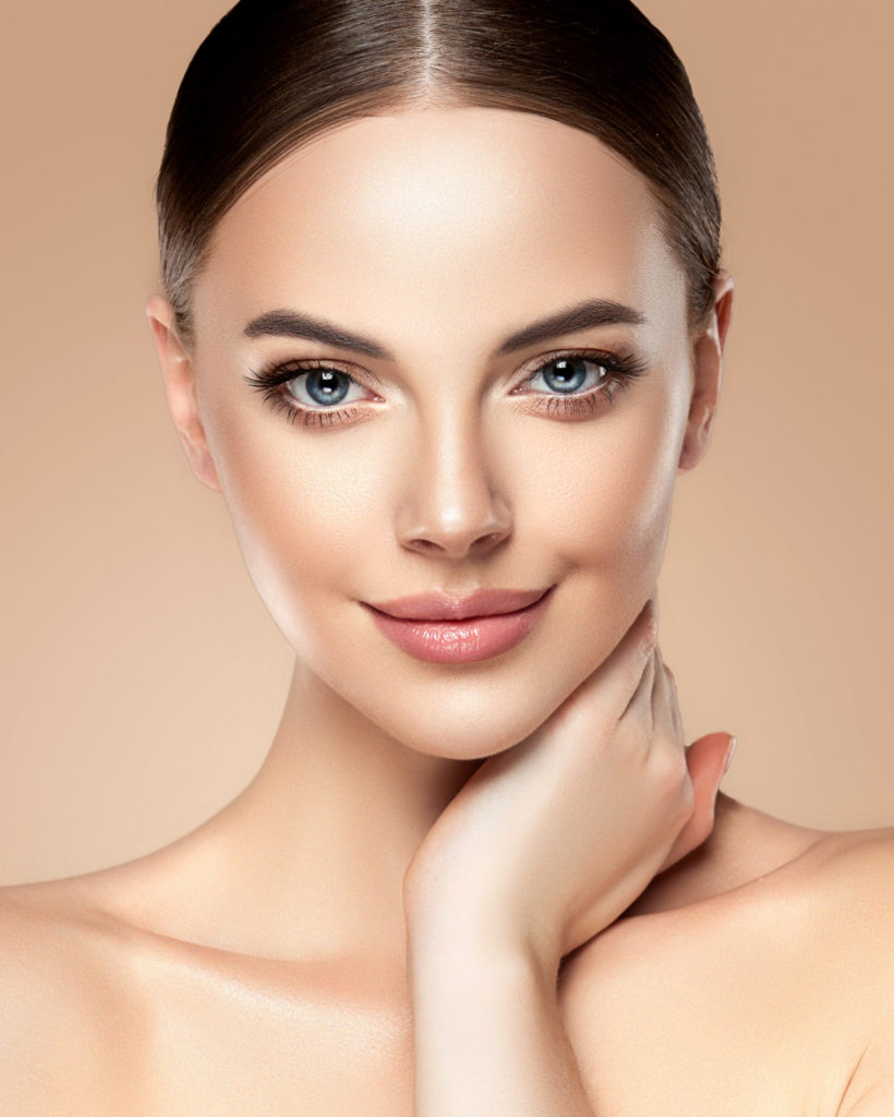 Beautiful,Young,Woman,With,Clean,Fresh,Skin,Touching,Her,Face